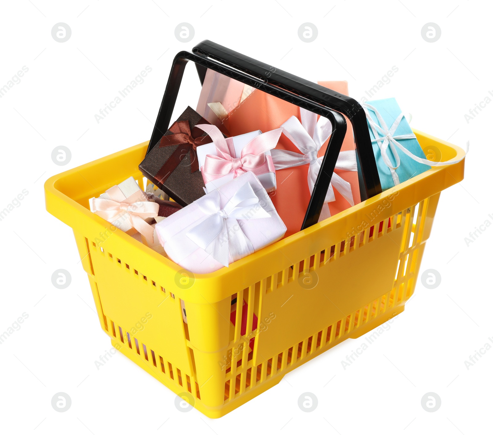 Photo of Shopping basket full of gift boxes on white background