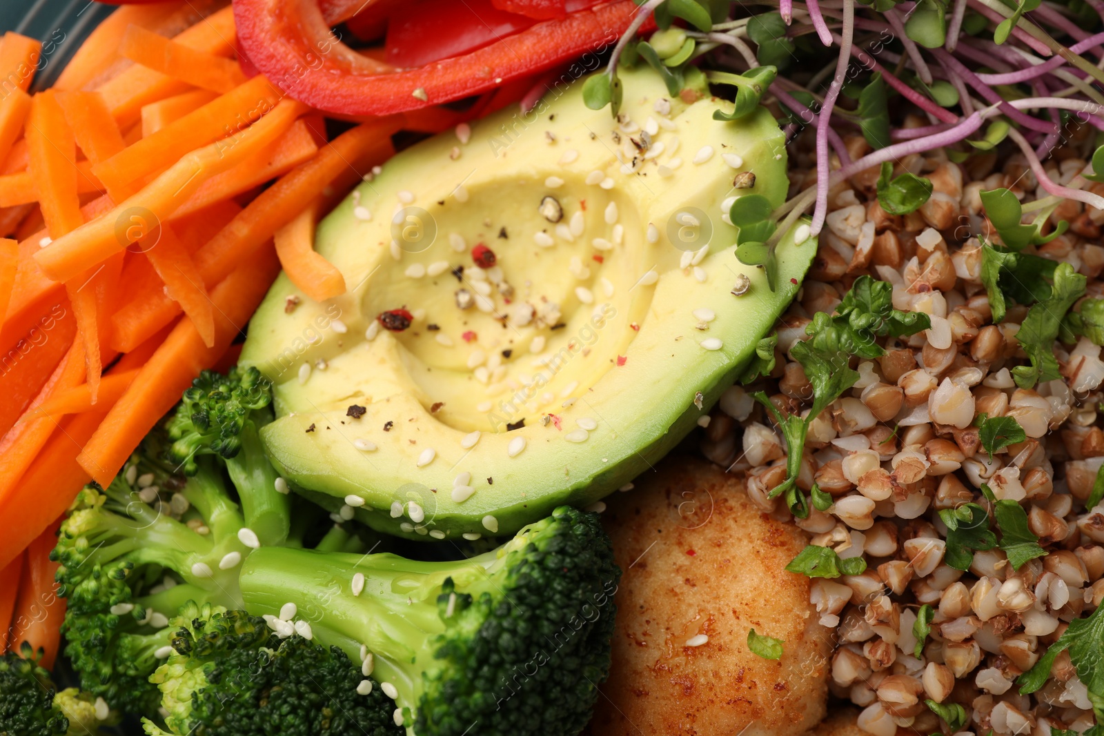 Photo of Delicious vegan bowl with avocado, broccoli and buckwheat as background