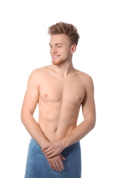 Portrait of young man with slim body in towel on white background