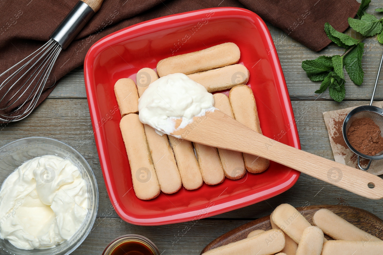 Photo of Flat lay composition with different ingredients for tiramisu cake on wooden table