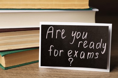 Card with question Are You Ready For Exams? on wooden table
