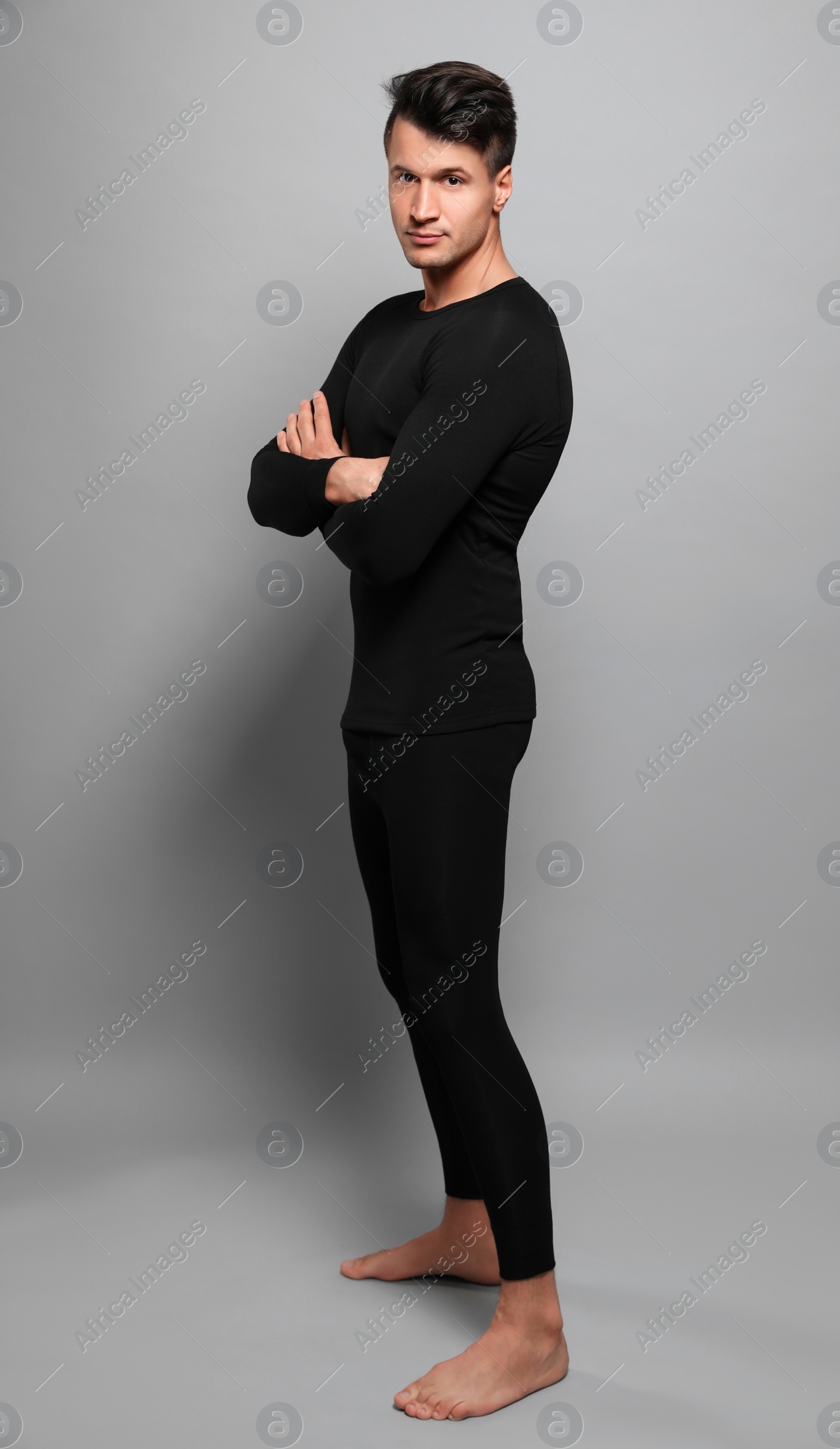 Photo of Man wearing thermal underwear on grey background