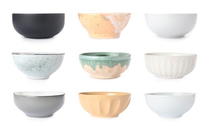 Image of Set with empty ceramic bowls on white background 