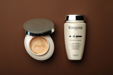 MYKOLAIV, UKRAINE - SEPTEMBER 07, 2021: Kerastase hair care cosmetic products on brown background, flat lay