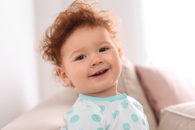 Photo of Portrait of cute little child at home