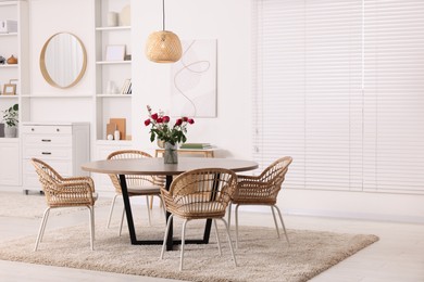 Photo of Stylish dining room interior with table and chairs. Space for text