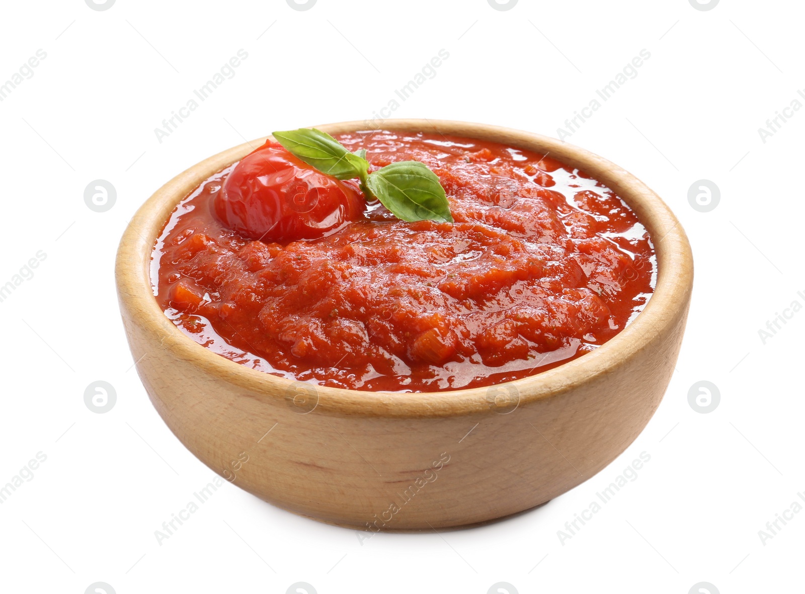 Photo of Homemade tomato sauce and basil in bowl isolated on white