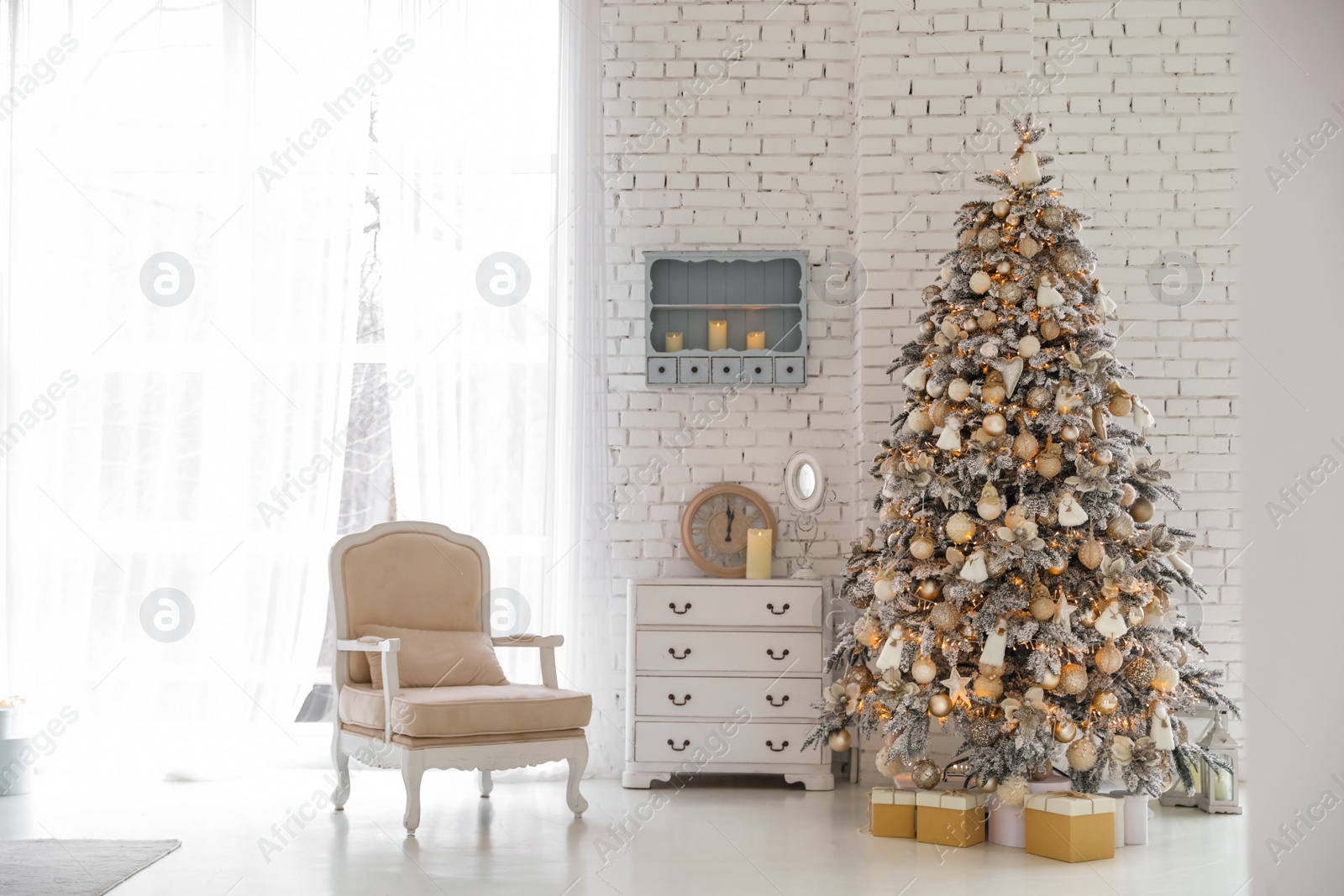 Photo of Beautiful room interior with decorated Christmas tree