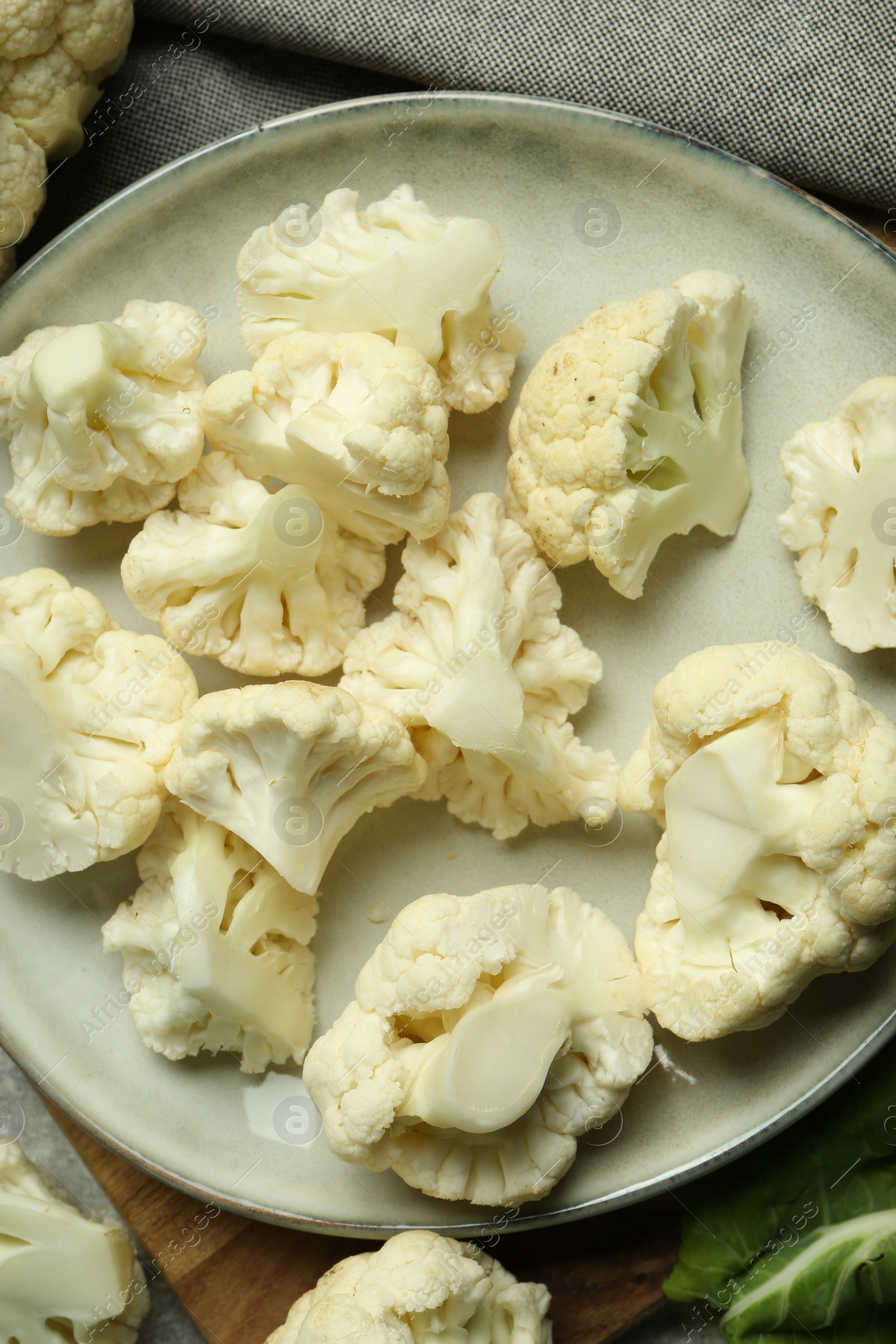 Photo of Cut fresh raw cauliflowers on table, flat lay