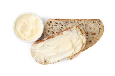 Photo of Slices of bread with tasty butter on white background, top view