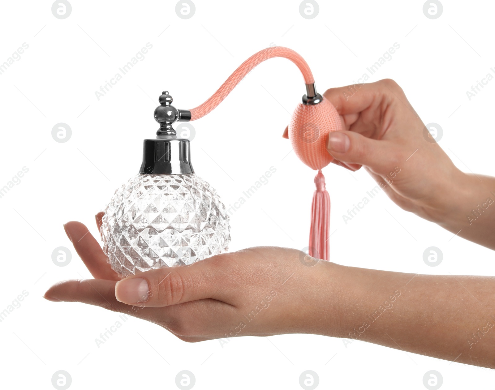 Photo of Woman holding bottle of luxury perfume on white background, closeup