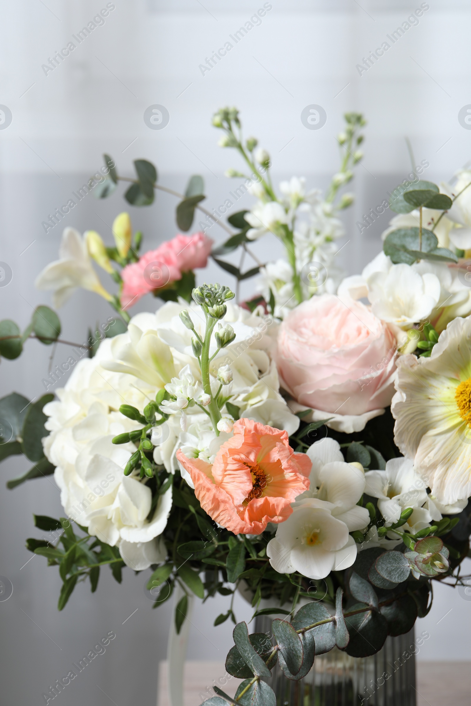 Photo of Bouquet of beautiful flowers on light background, closeup