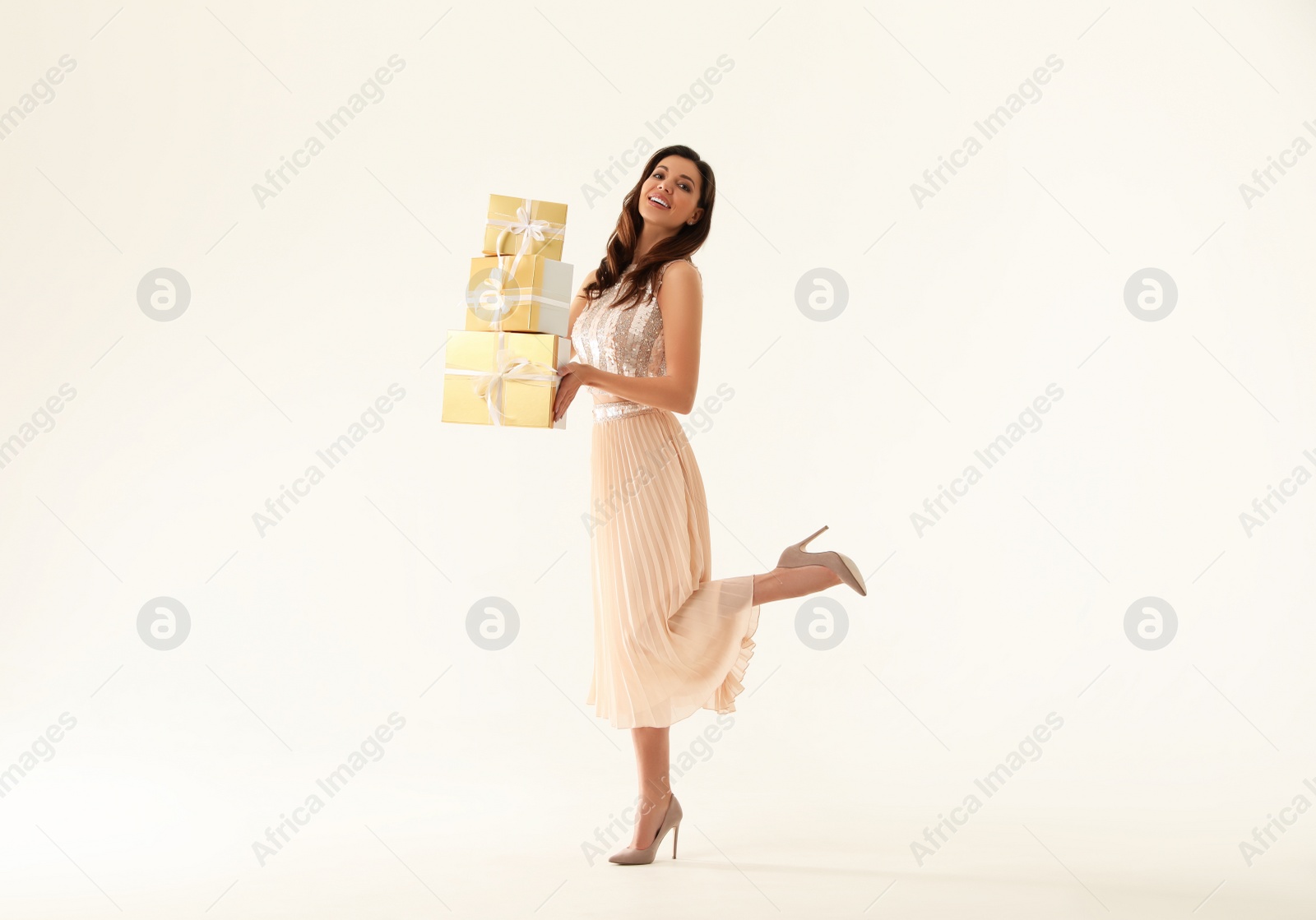 Photo of Beautiful woman with Christmas gifts on white background