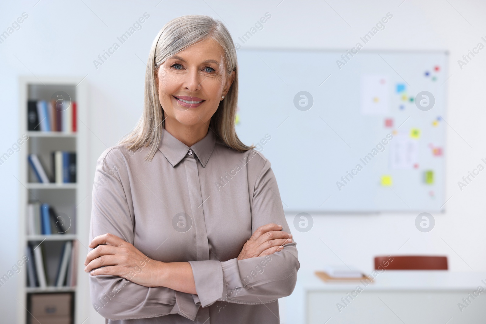 Photo of Portrait of happy professor in classroom, space for text