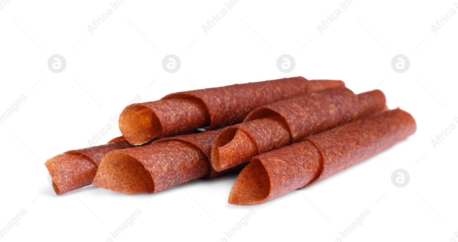 Photo of Delicious fruit leather rolls on white background