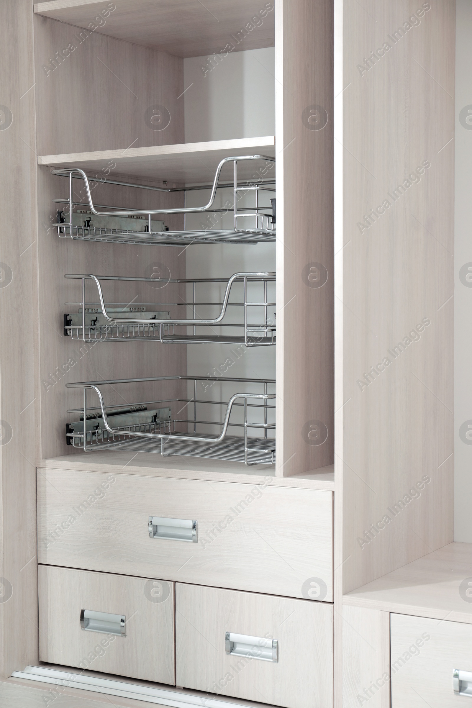 Photo of Empty wooden wardrobe with shelves and drawers as background