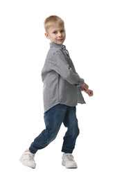 Happy little boy dancing on white background