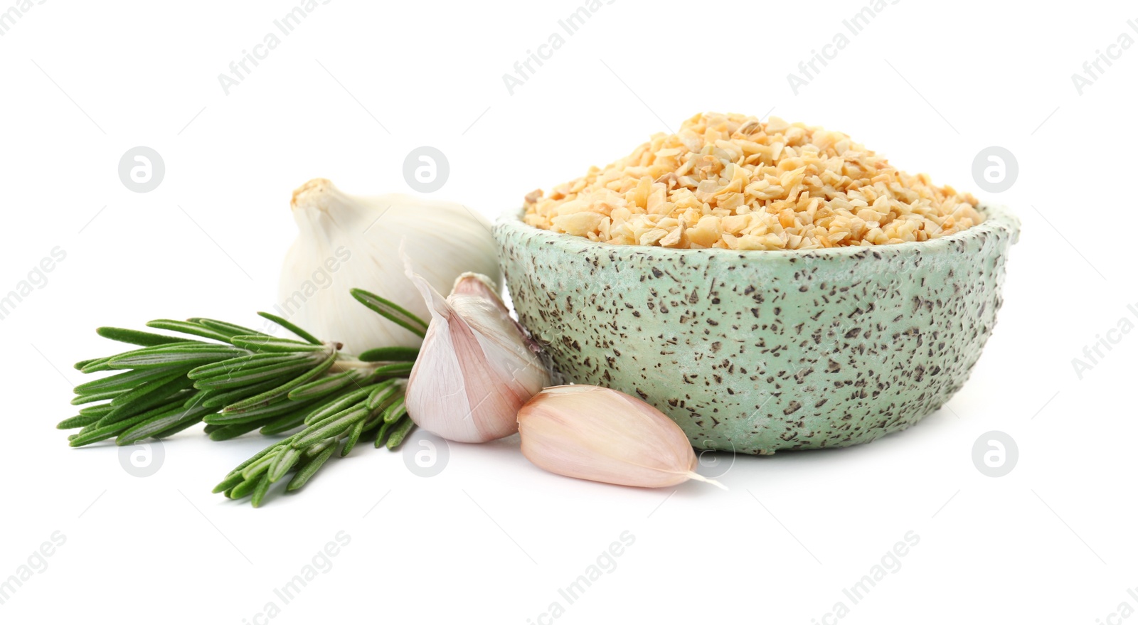 Photo of Bowl of granulated dry garlic and rosemary on white background