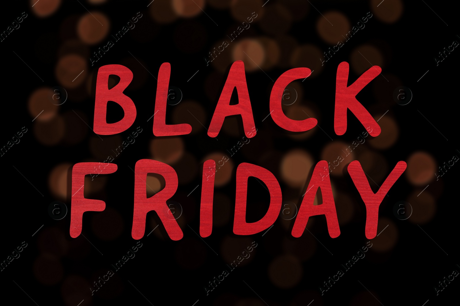 Image of Phrase Black Friday and blurred view of beautiful lights on background 