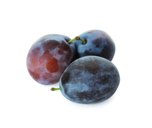 Delicious fresh ripe plums on white background