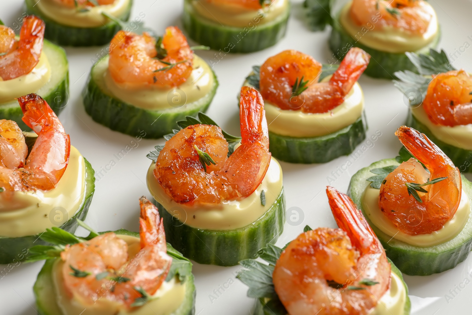 Photo of Delicious snacks with shrimp on plate