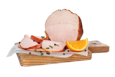 Photo of Delicious cut ham with thyme, orange slice and peppercorns isolated on white