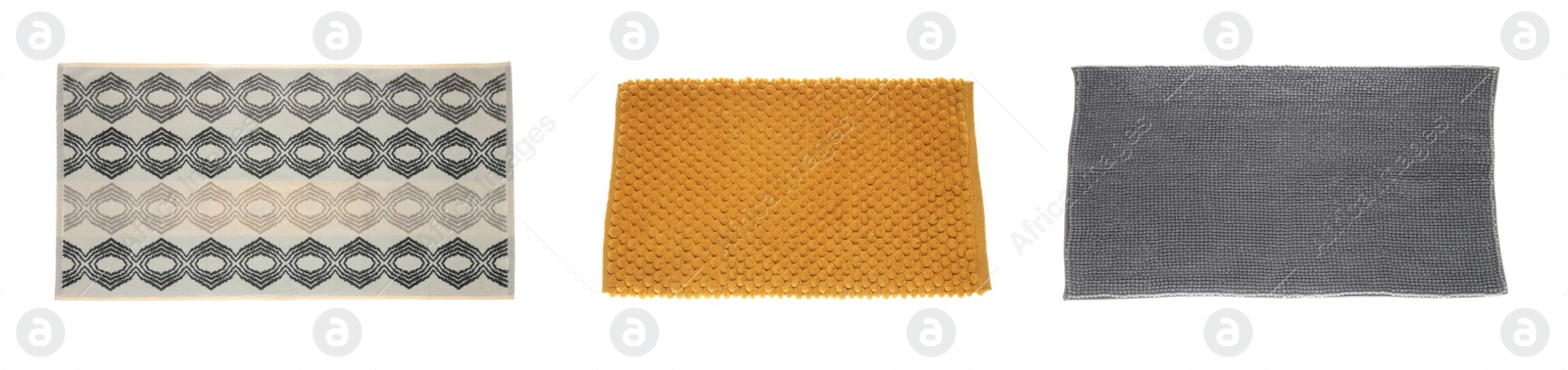 Image of Set with soft bath mats on white background, top view. Banner design