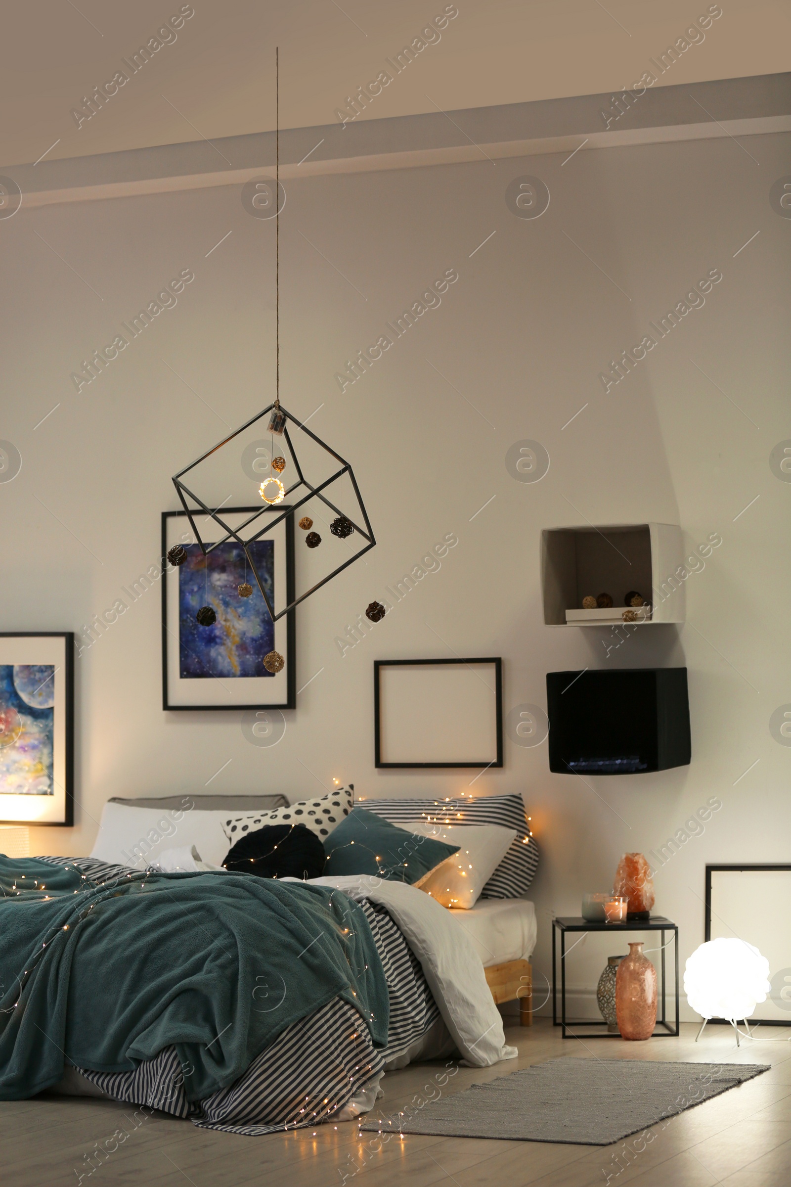 Photo of Stylish room interior with comfortable bed and decor