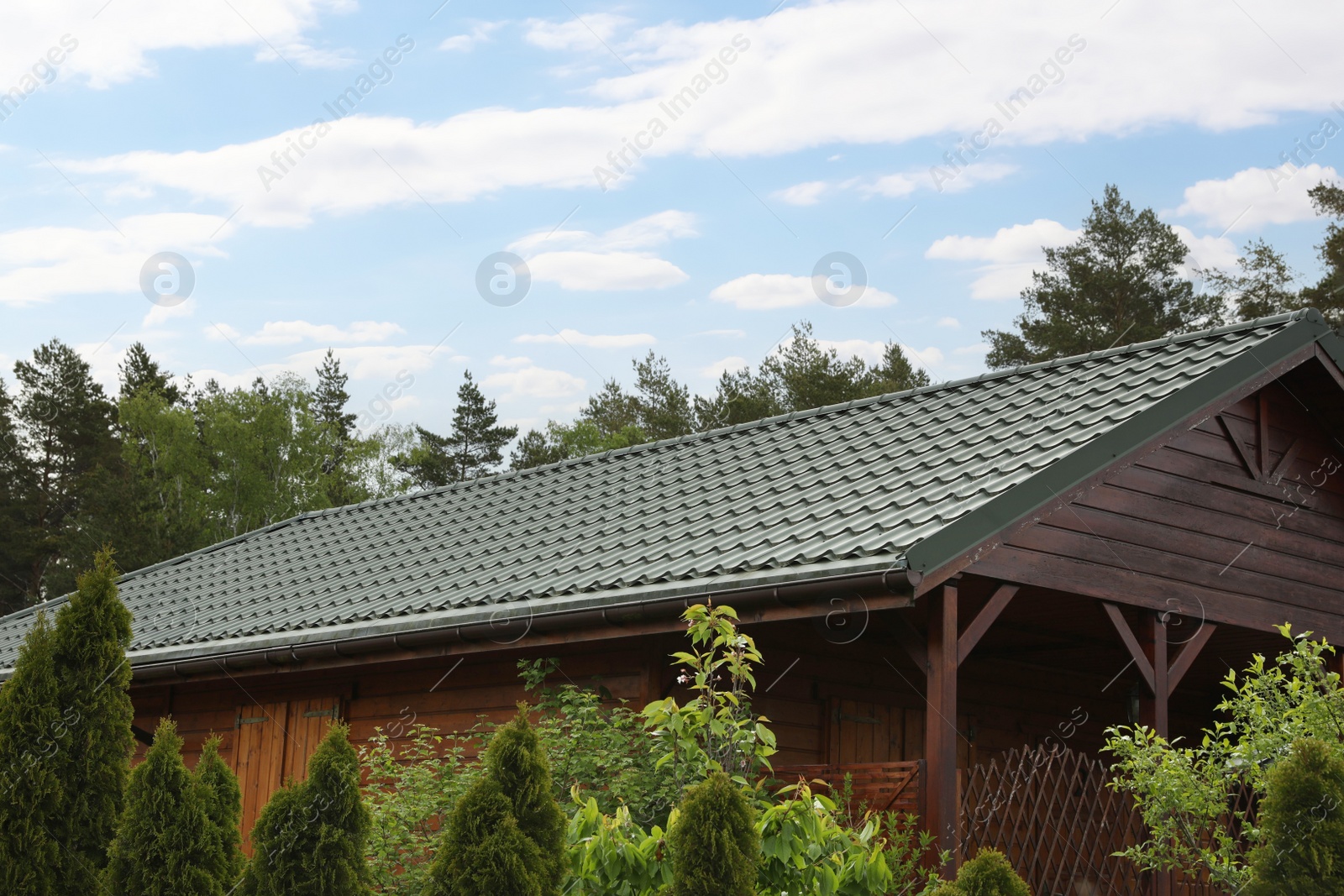 Photo of Modern building with green roof outdoors on spring day