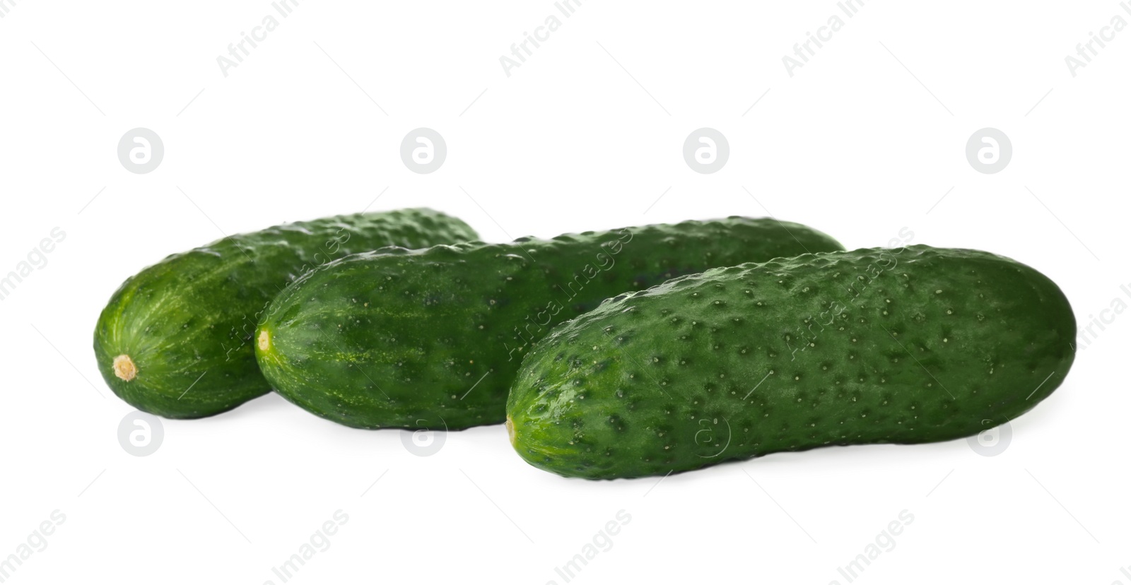 Photo of Whole fresh green cucumbers on white background