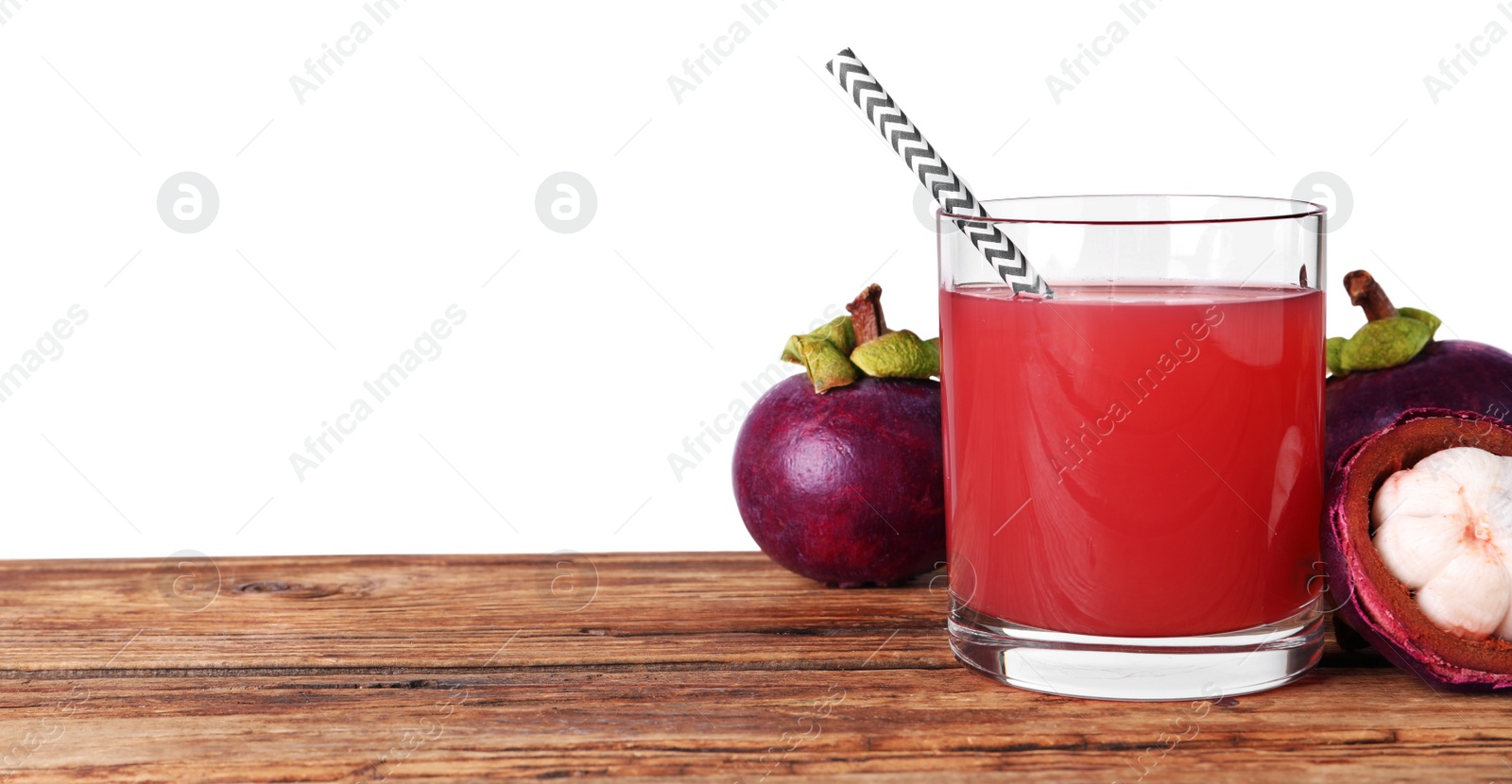Photo of Delicious mangosteen juice and fresh fruits on wooden table against white background. Space for text