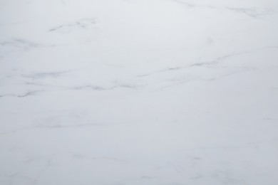 Photo of Texture of white marble surface as background, top view