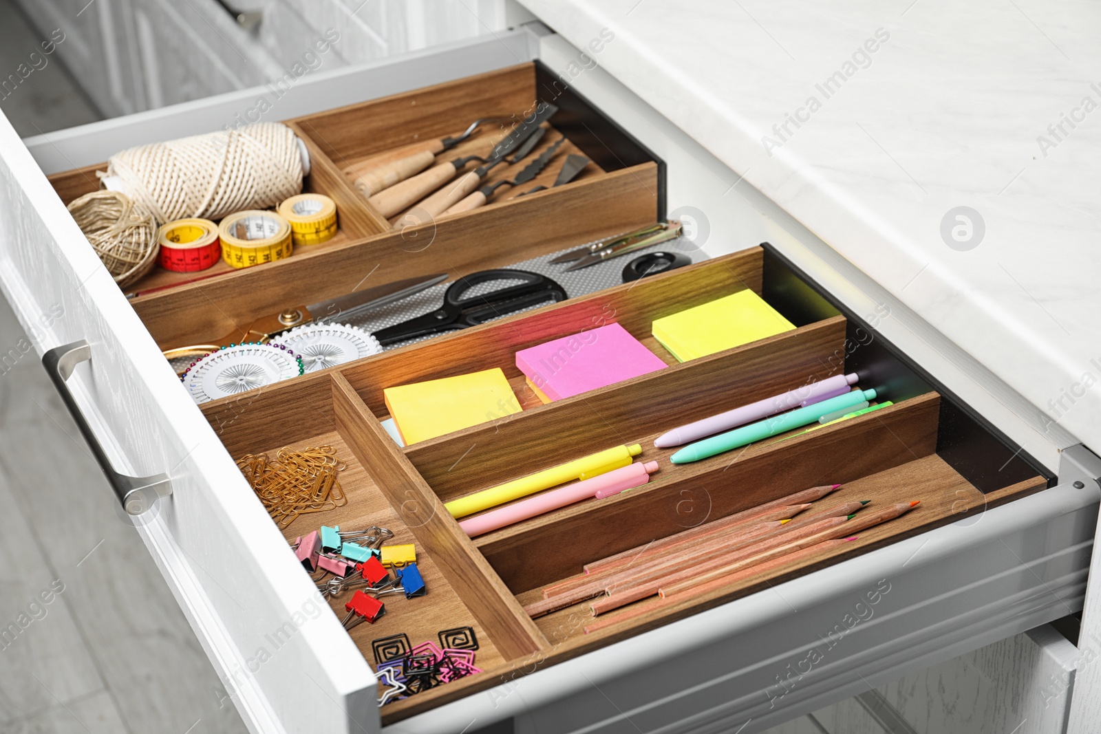 Photo of Different stationery in open desk drawer indoors