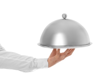 Waiter holding metal tray with lid on white background, closeup