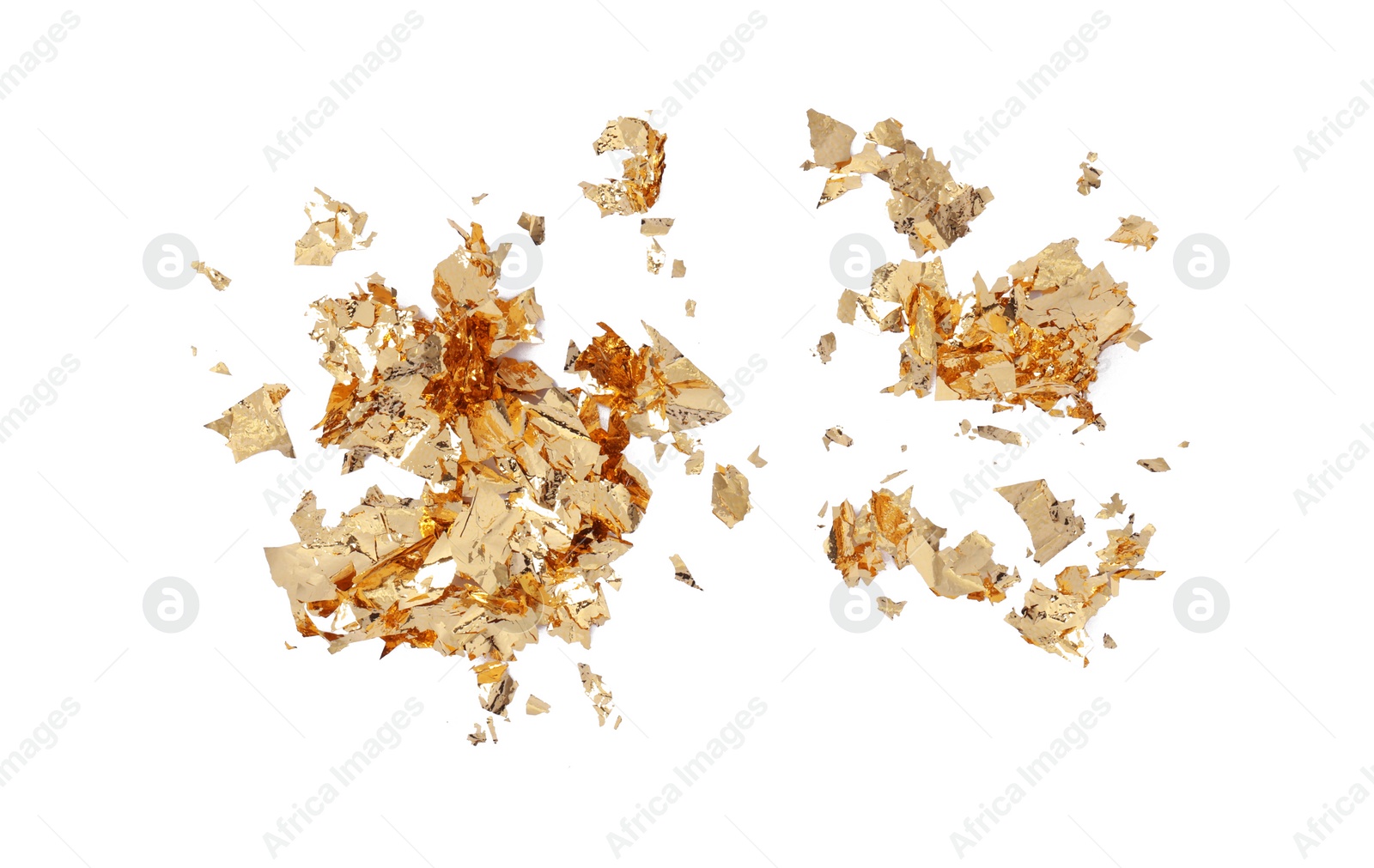 Photo of Many pieces of edible gold leaf isolated on white, top view