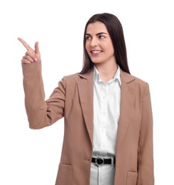 Photo of Beautiful happy businesswoman pointing at something on white background