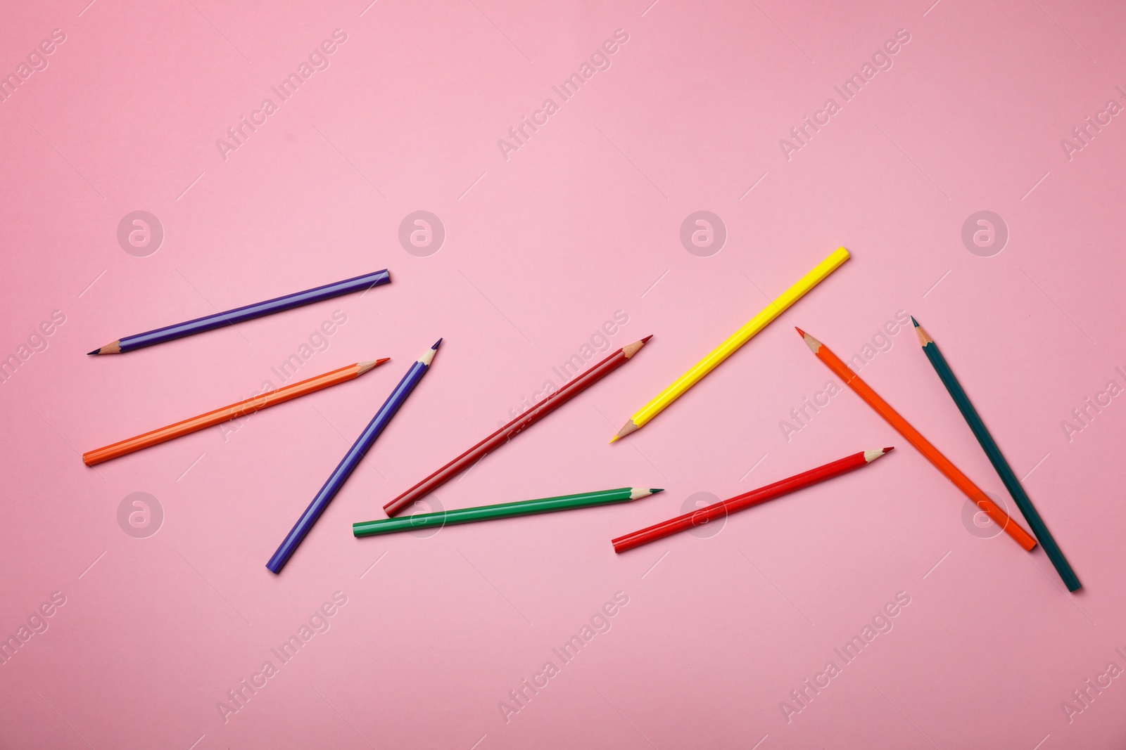 Photo of Collection of pencils on table, top view. Color palette