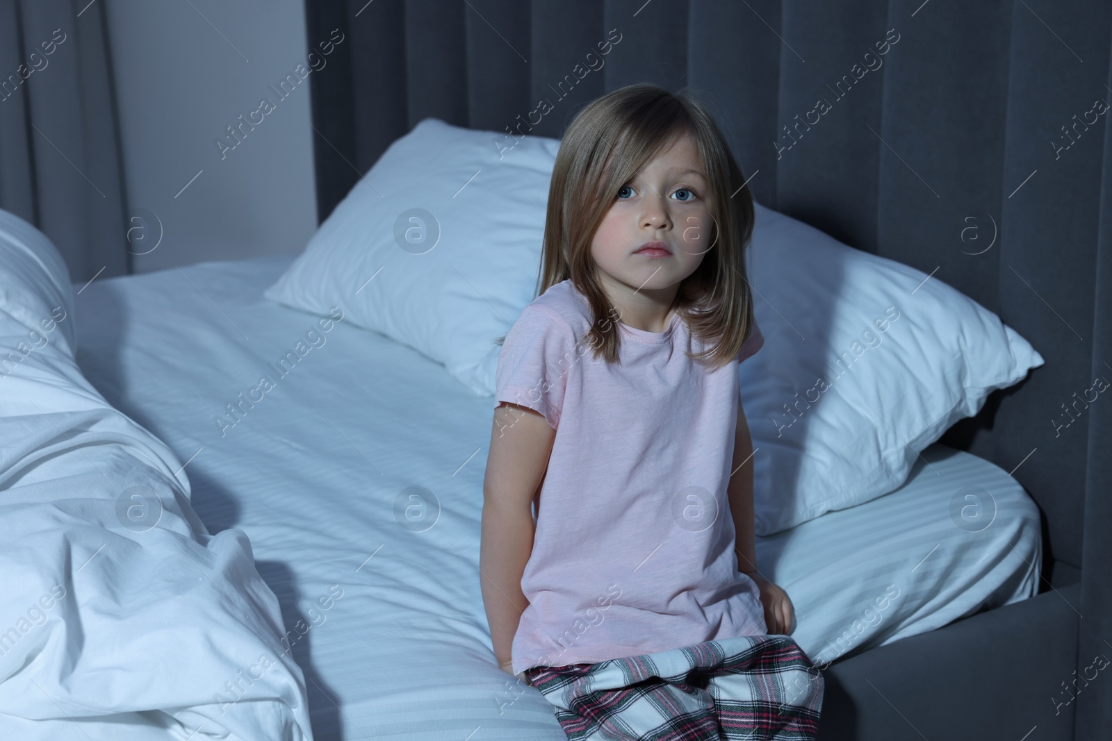 Photo of Portrait of little sleepy girl in bedroom, space for text