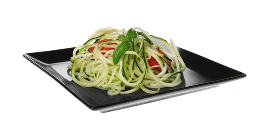 Tasty zucchini pasta with tomatoes and basil isolated on white