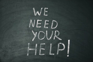 Photo of Phrase "We need your help" written on chalkboard