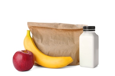 Healthy food and paper bag on white background. School lunch