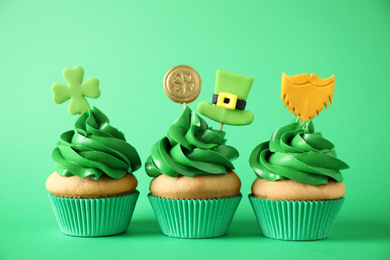 Decorated cupcakes on green background. St. Patrick's Day celebration