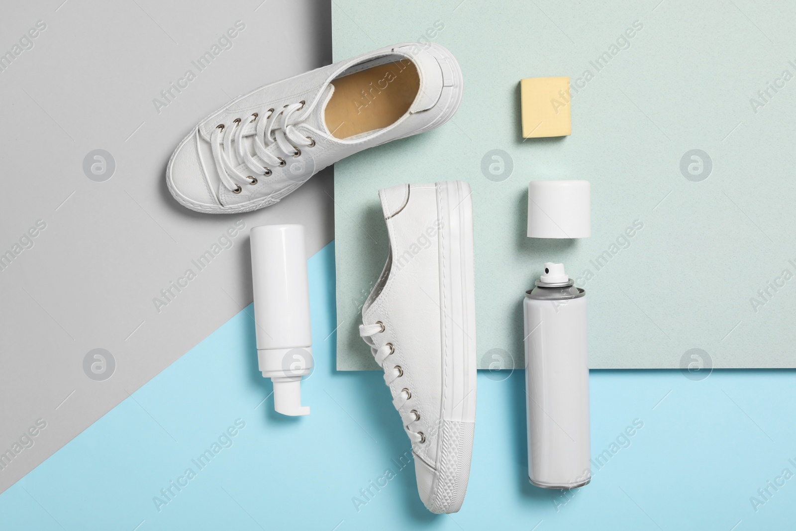 Photo of Flat lay composition with stylish footwear and shoe care accessories on color background