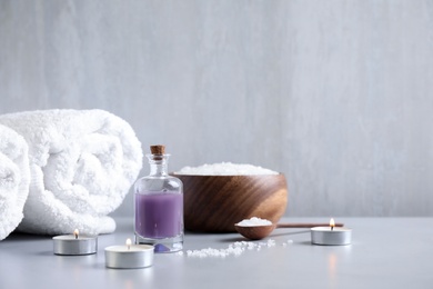 Photo of Composition with different spa items on grey table, space for text