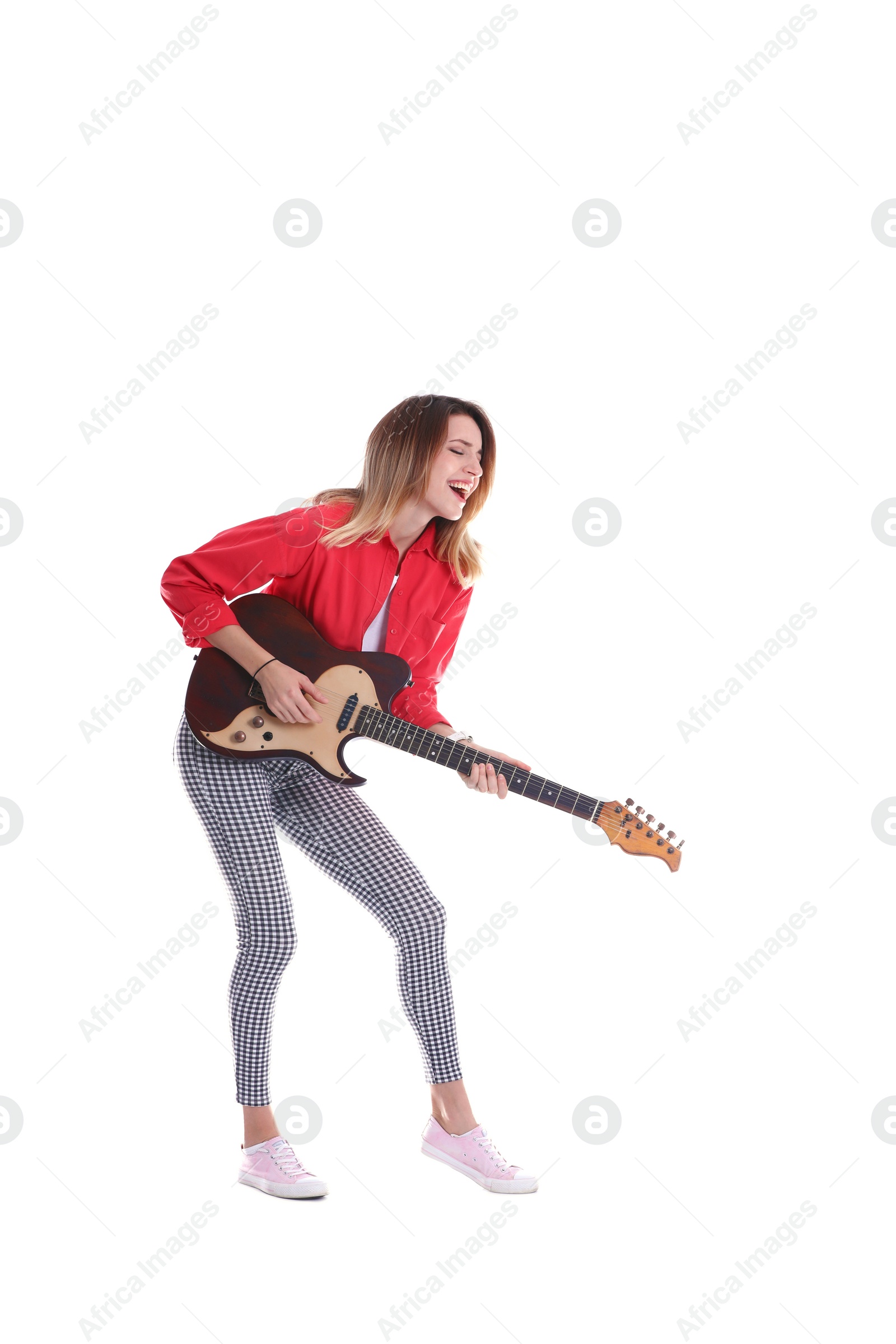 Photo of Young woman playing electric guitar on white background