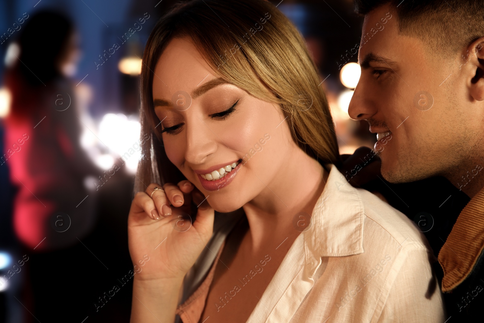 Photo of Man and woman flirting with each other in bar