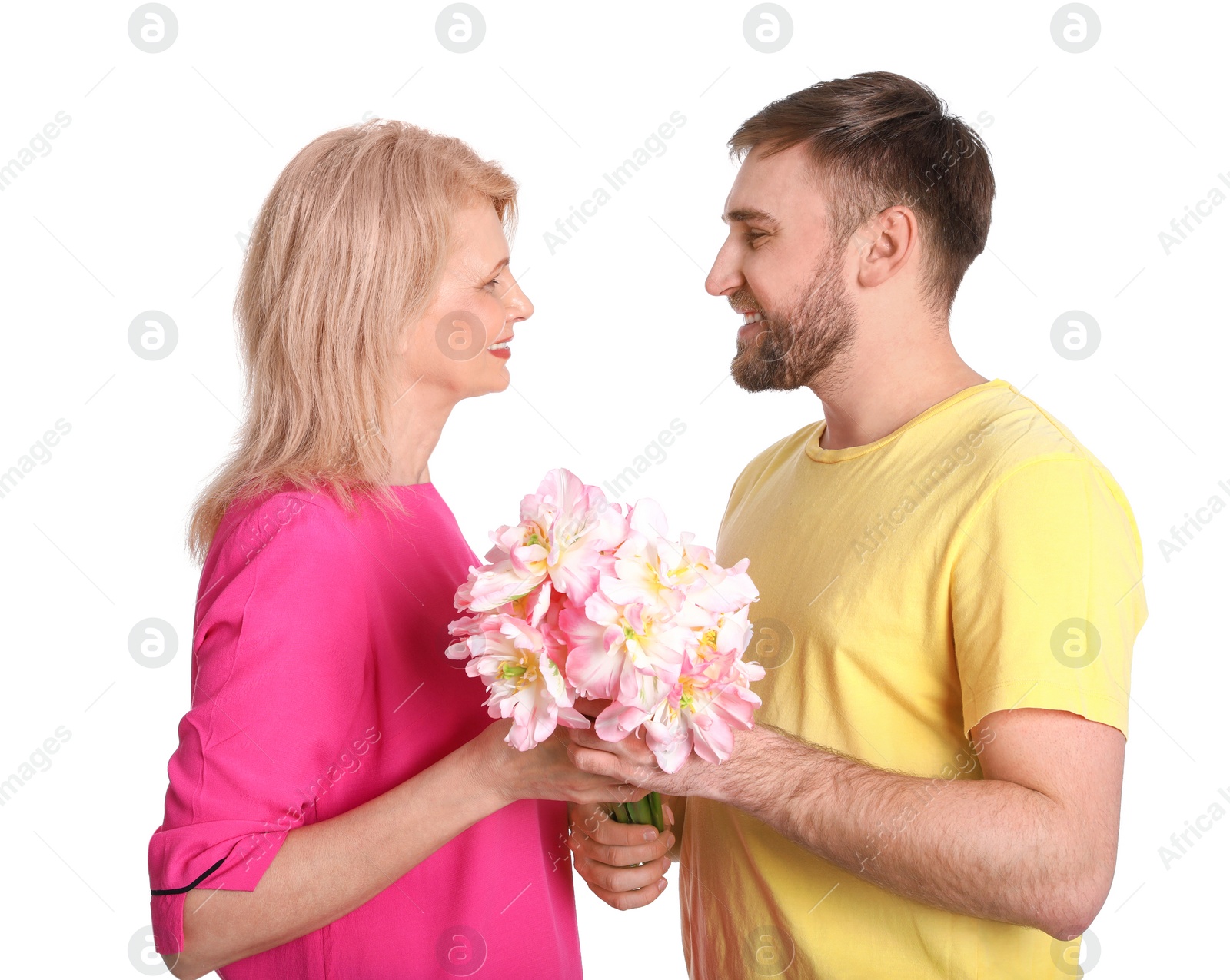 Photo of Young man congratulating his mature mom on white background. Happy Mother's Day
