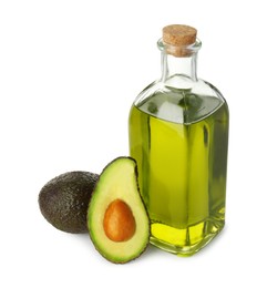 Vegetable fats. Bottle of cooking oil and fresh avocados isolated on white