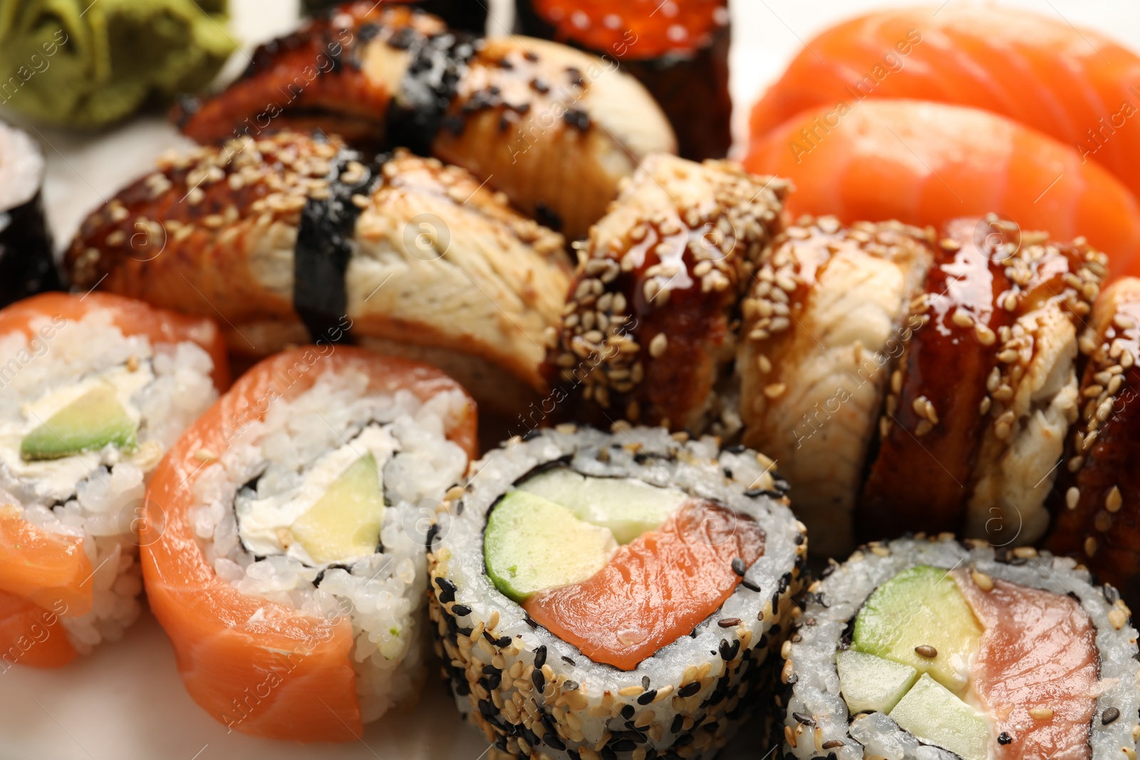 Photo of Set of delicious sushi rolls, closeup view