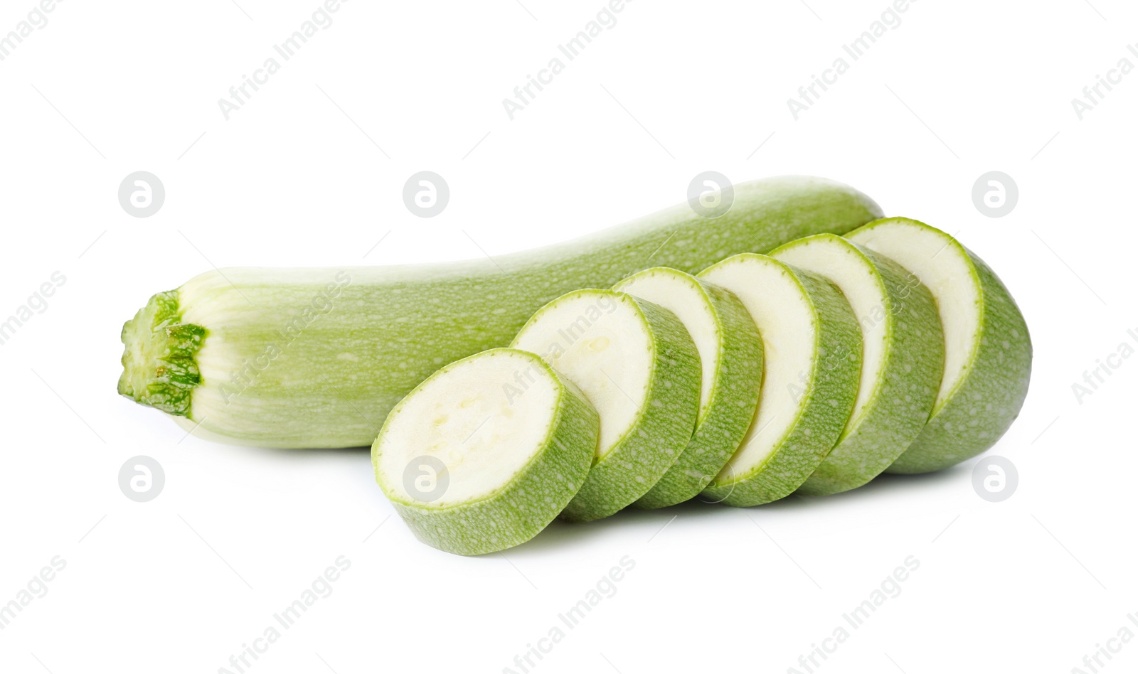 Photo of Cut and whole green ripe zucchinis on white background